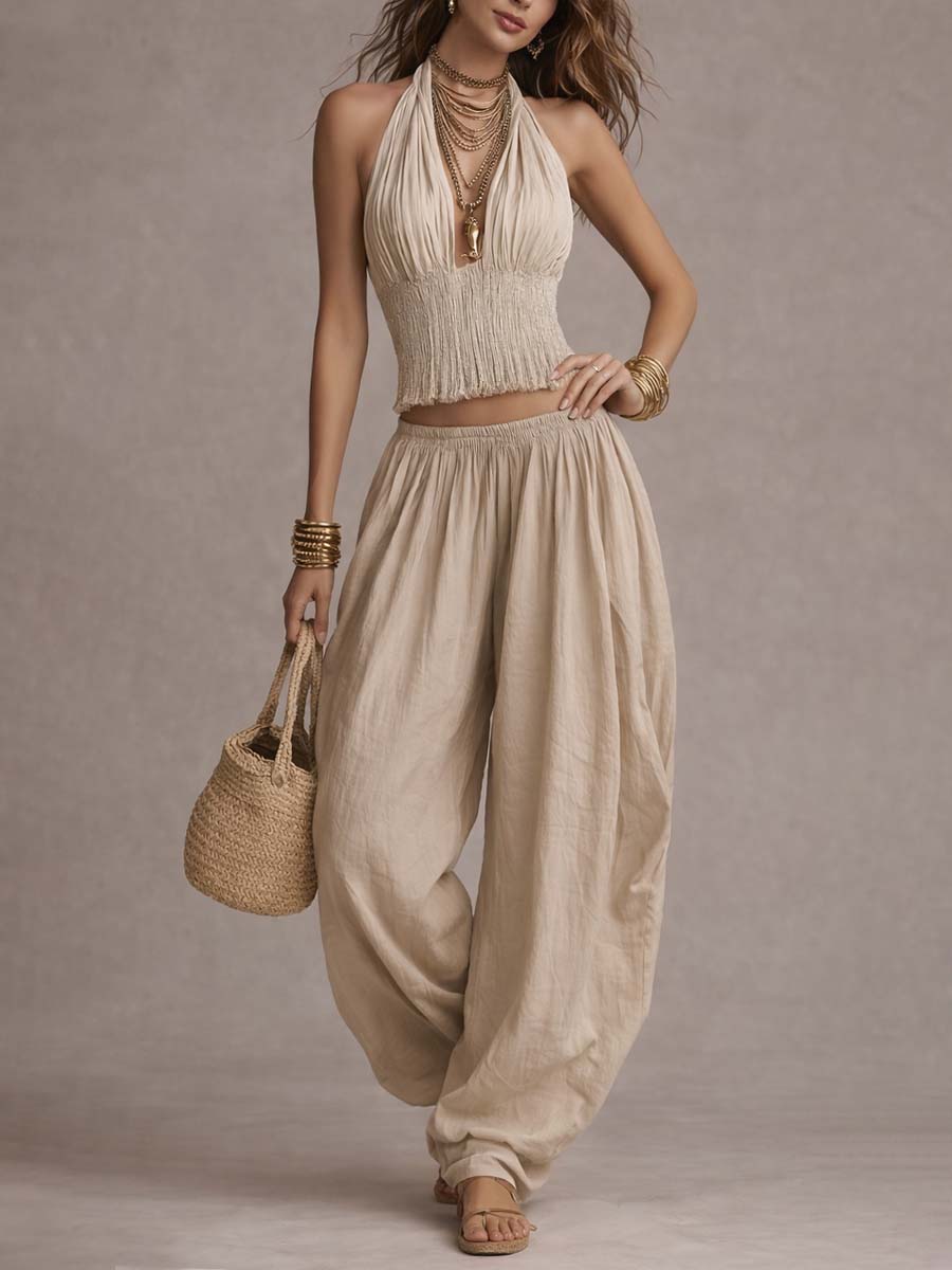 Beige halter two-piece set with fringe crop top and gathered balloon pants, sleeveless