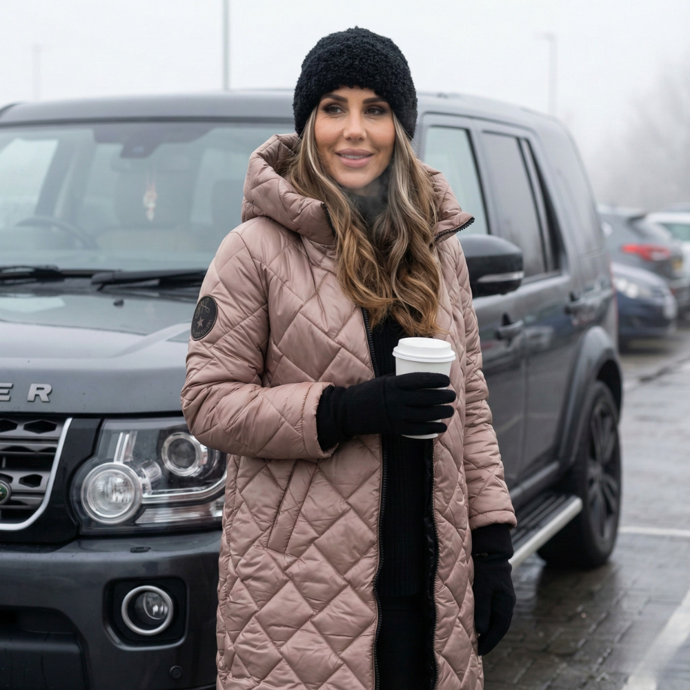 Pink quilted hooded winter coat with zip front and long sleeves
