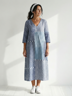 Blue patchwork midi dress with V-neck, 3/4 sleeves, and patch panel details