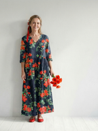 Floral midi dress in dark blue with orange-red blooms, three-quarter sleeves