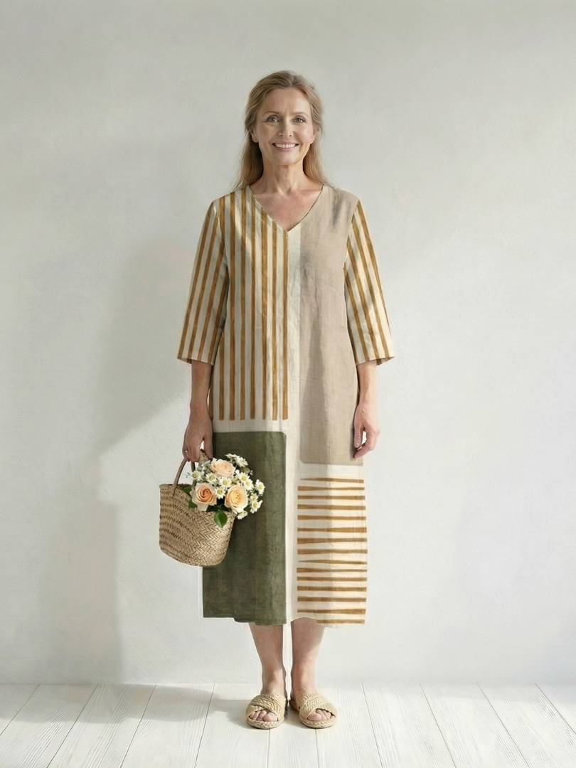 Women's striped midi dress with V-neck, three-quarter sleeves, and patchwork panels