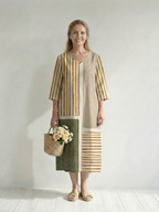 Women's striped midi dress with V-neck, three-quarter sleeves, and patchwork panels