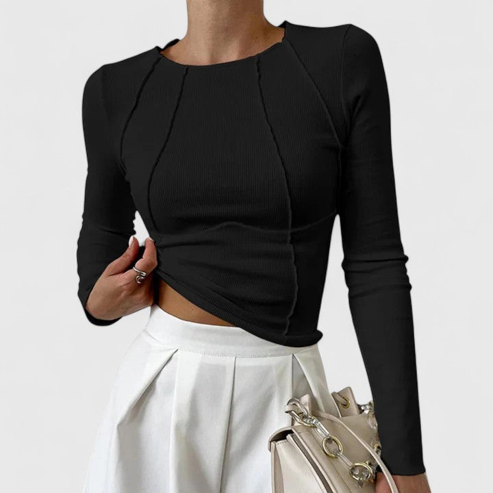 Black ribbed knit long-sleeve top with round neck and draped asymmetrical hem