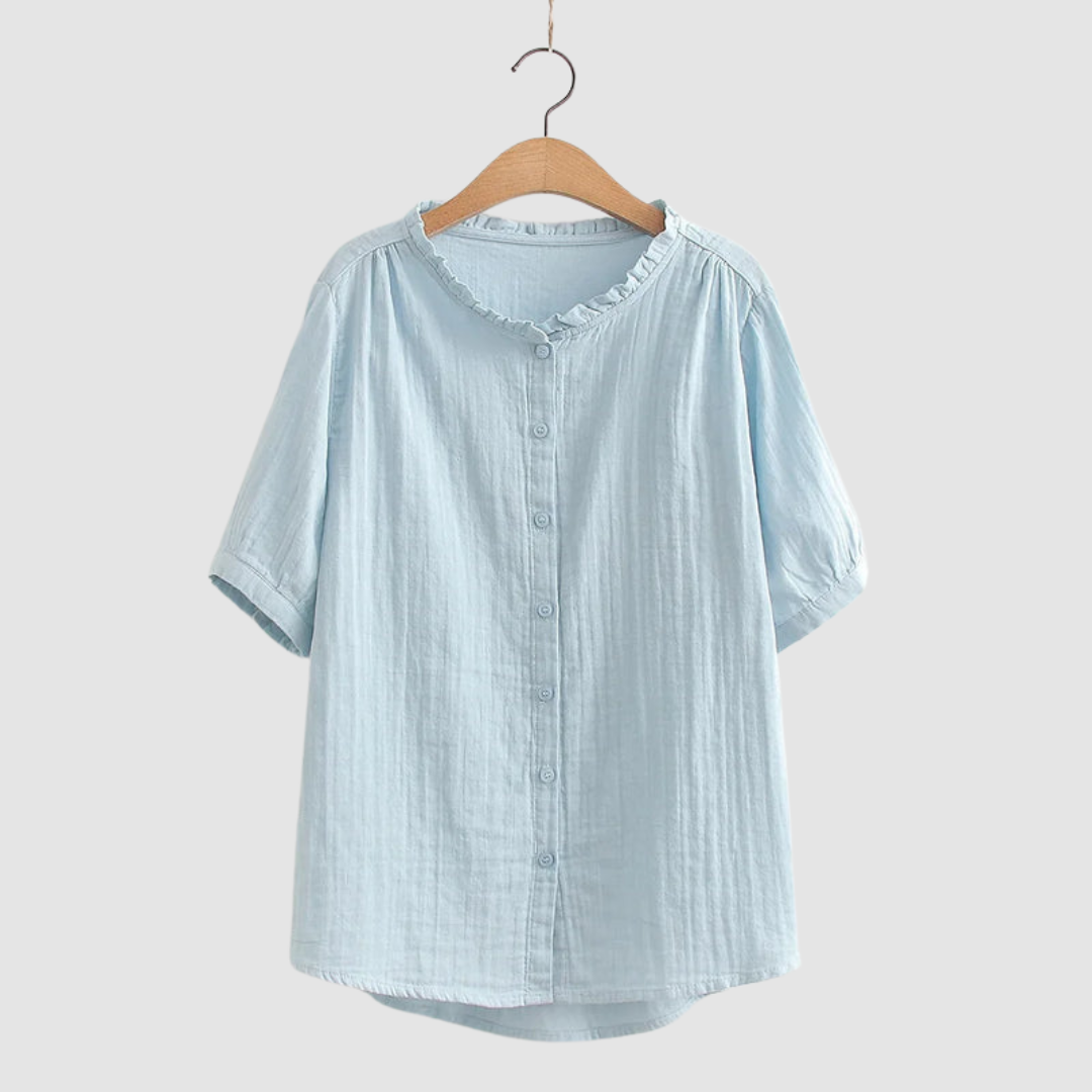 Lightweight cotton shirt in light blue, short sleeves, button front, ruffled crew neck.