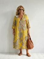 Yellow paisley midi dress with V-neck and three-quarter sleeves