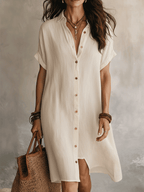 White linen relaxed midi dress with short sleeves, V-neck, and button front placket
