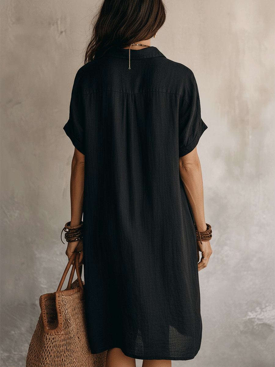 Black linen relaxed midi dress, back view with short sleeves and button back top panel