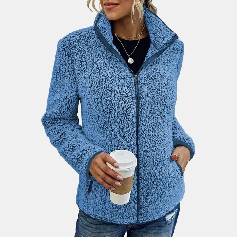 Blue teddy fleece zip-up jacket on model, stand collar with front zip