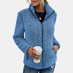 Blue teddy fleece zip-up jacket on model, stand collar with front zip