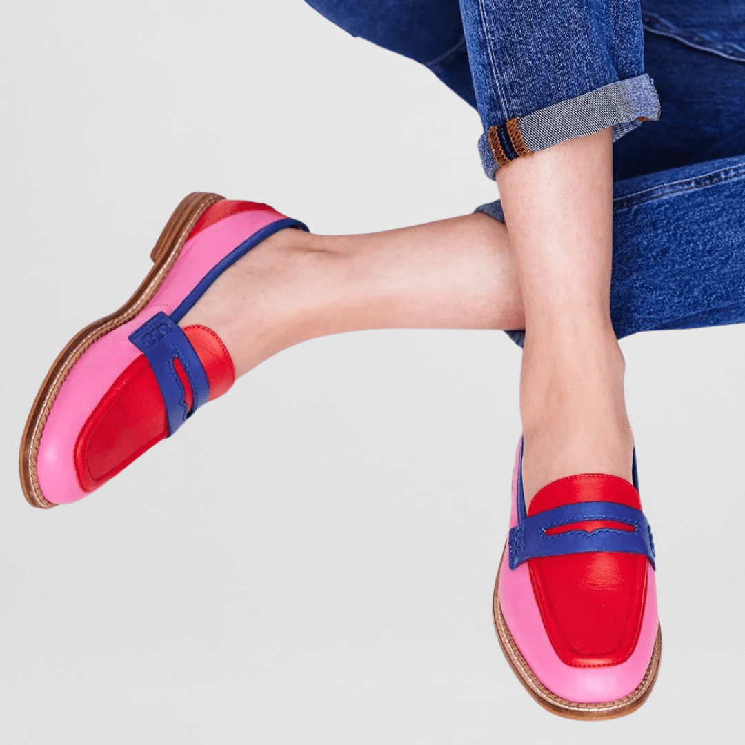 Pink loafer pair with red front accents and blue strap, tan sole