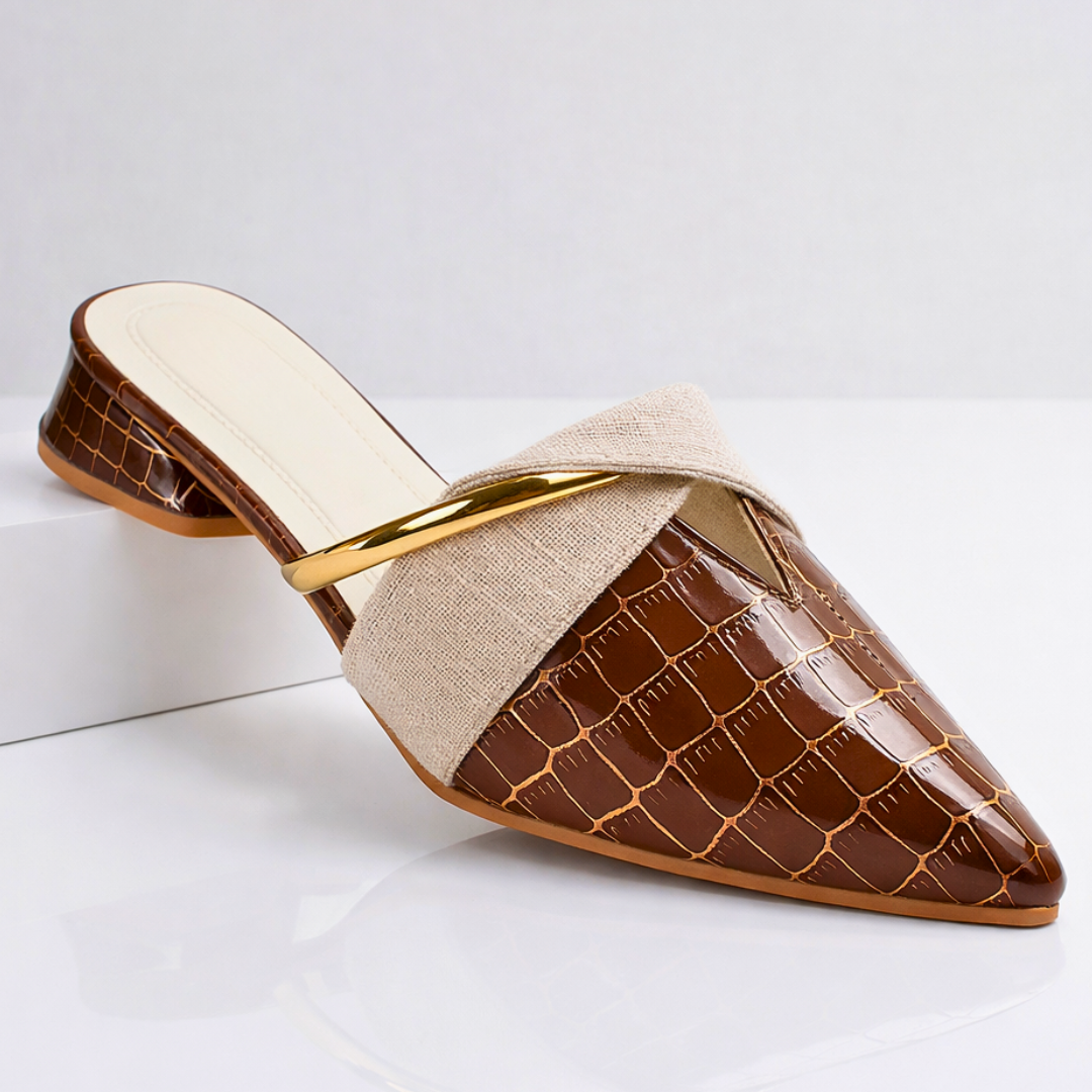 Brown gator-pattern slip-on mule with beige fabric strap and gold bar accent