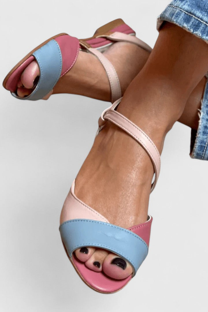 Open-toe ankle-strap sandals with decorative toe face, pink, light blue, and white