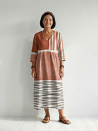 Rust brown midi dress with V-neck, 3/4 sleeves, vertical stripe panels and striped hem