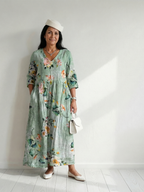 Sage green midi dress with floral print, gathered waist, three-quarter sleeves