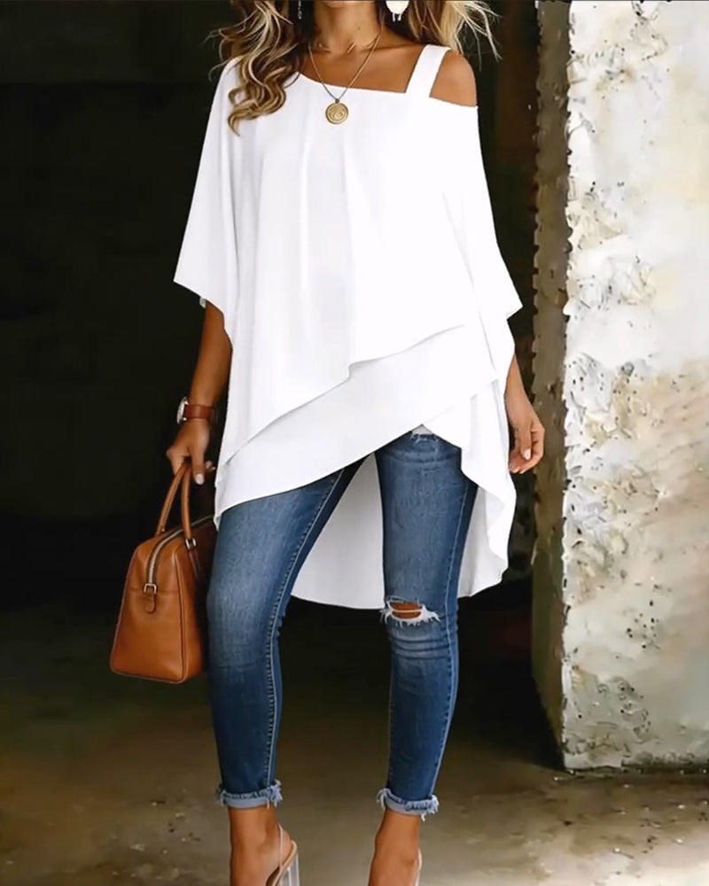White asymmetric blouse with draped hem and wide shoulder straps