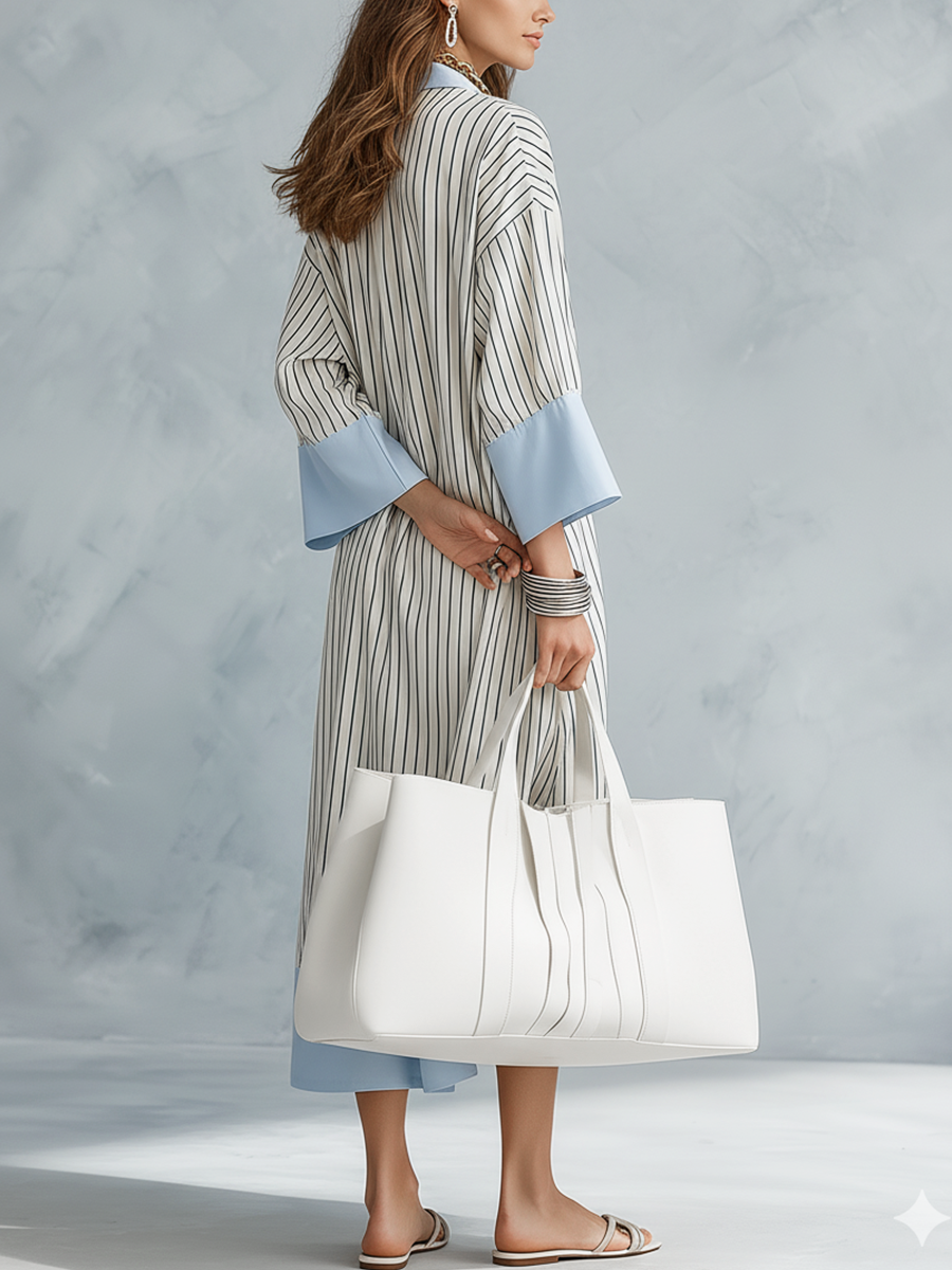 Blue and white vertical striped midi dress with V-neck and light-blue flared cuffs