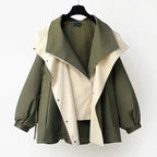 Two-tone windbreaker jacket, olive outer with off-white front panel and stand collar snaps