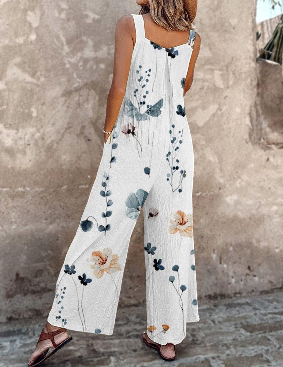 White sleeveless wide-leg jumpsuit with blue and brown flower print