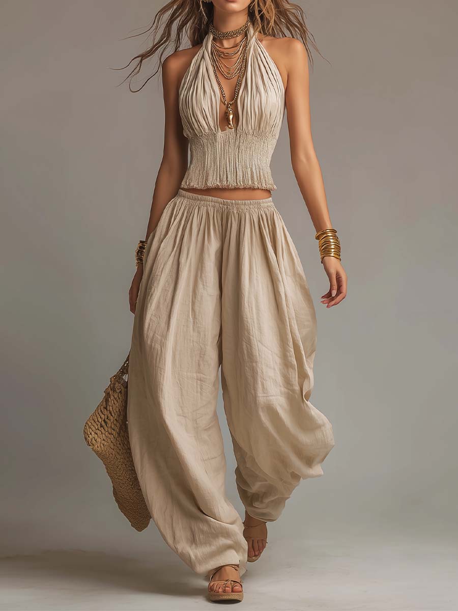 Beige halter two-piece set with fringe crop top and flowy balloon pants, sleeveless