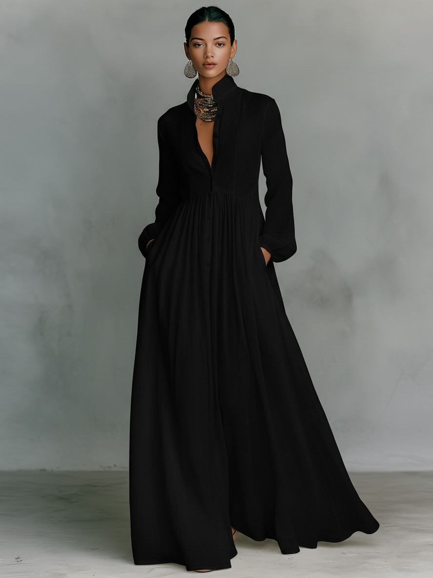 Women's black long-sleeve maxi dress with stand-up collar, button-front and patchwork panels
