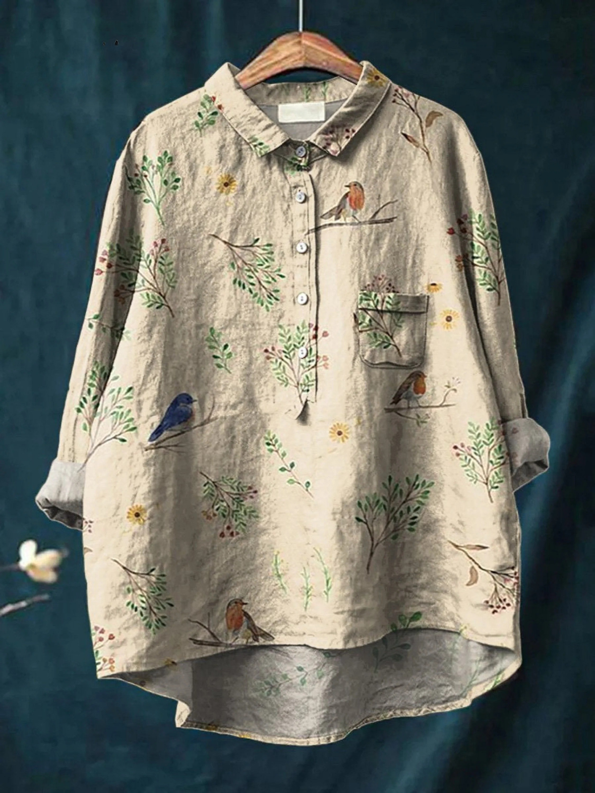 Light beige women’s casual shirt with button placket, patch pocket, and bird & floral print