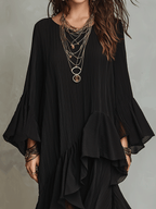 Black boho midi dress with pleated bodice, layered ruffle hem, and flared sleeves
