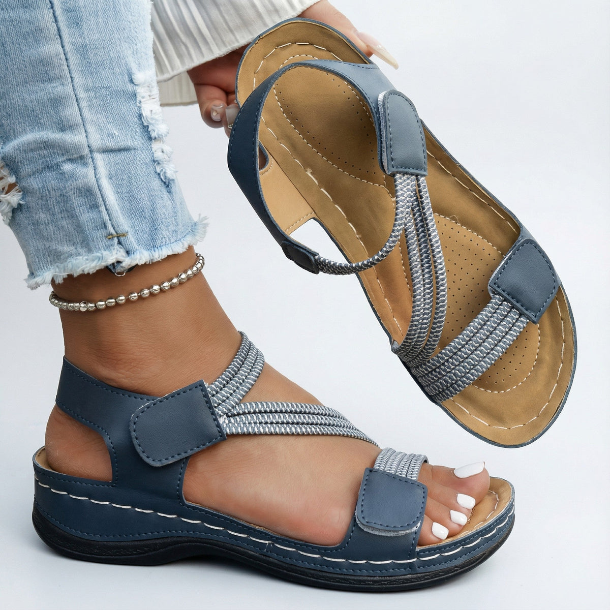 Blue orthopedic comfort sandals with crisscross strap and two buckle closures
