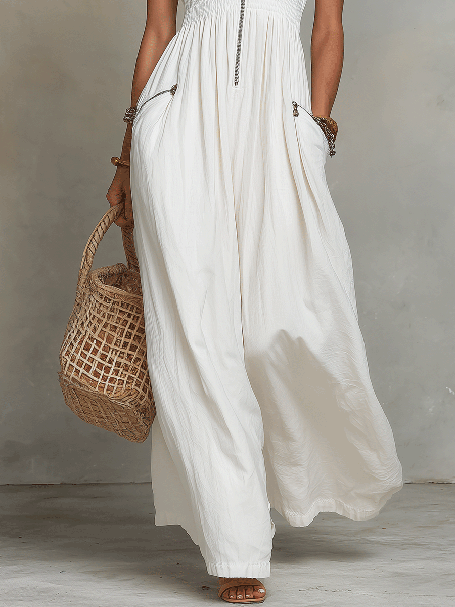 White zip-front sleeveless maxi dress with gathered skirt and side pocket zips