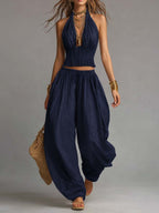 Navy halter two-piece set with fringe crop top and flowy balloon pants, sleeveless