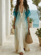 Aqua ombre maxi kaftan dress with V-neck and ornate gold embroidery, flowing drape
