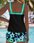 Two-piece beach tankini with black ribbed tank and teal-trimmed floral shorts