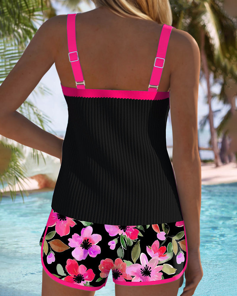 Two-piece beach tankini with black ribbed tank and purple-trimmed floral shorts