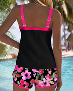 Two-piece beach tankini with black ribbed tank and purple-trimmed floral shorts