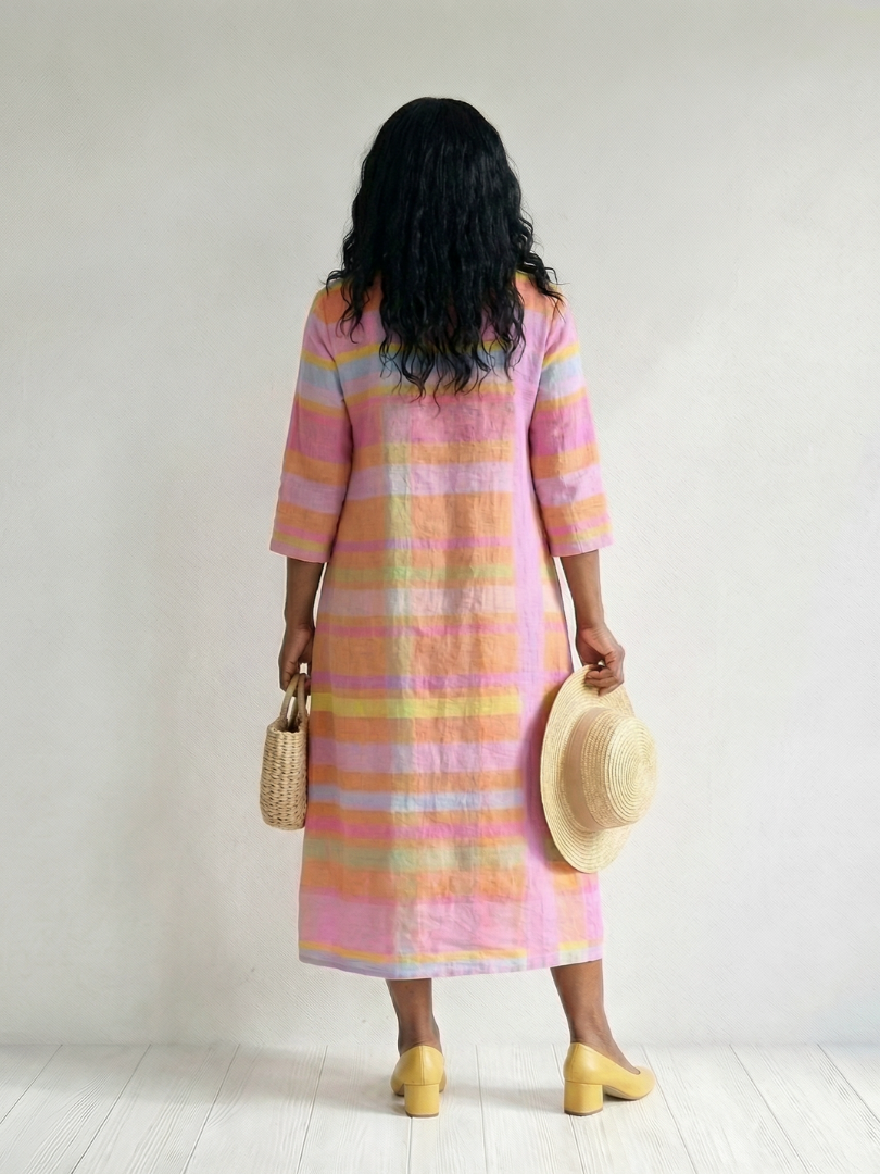 Back view of pink striped midi dress with three-quarter sleeves