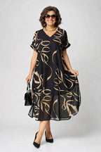 Women's black midi dress with gold abstract swirl print, V-neck, short sleeves