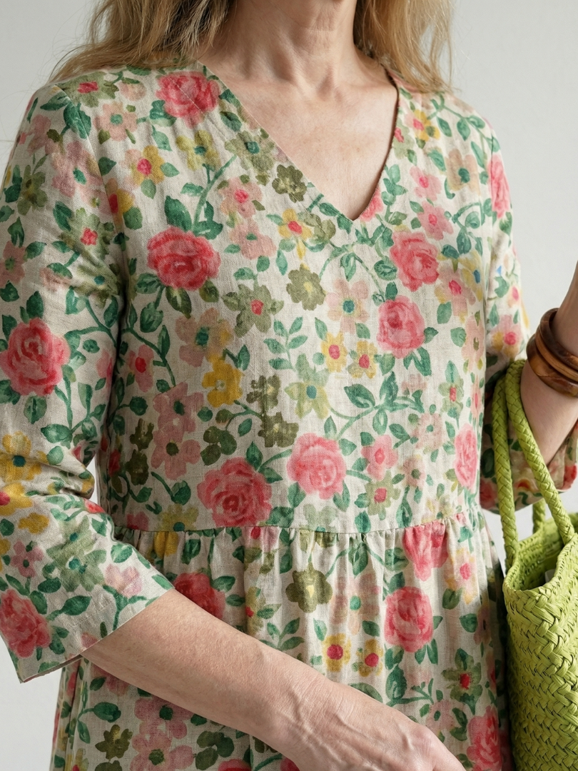Floral V-neck midi dress with ruched waist and gathered cuffs, three-quarter sleeves