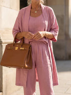 Women's pink linen-style set with scoop tank, wide-leg pants, and open kimono cardigan