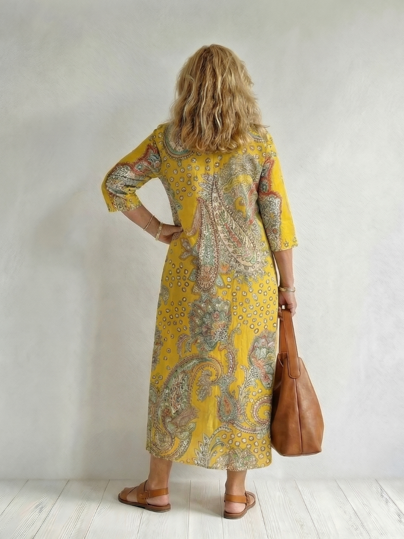 Yellow paisley midi dress back view with V-neck and three-quarter sleeves