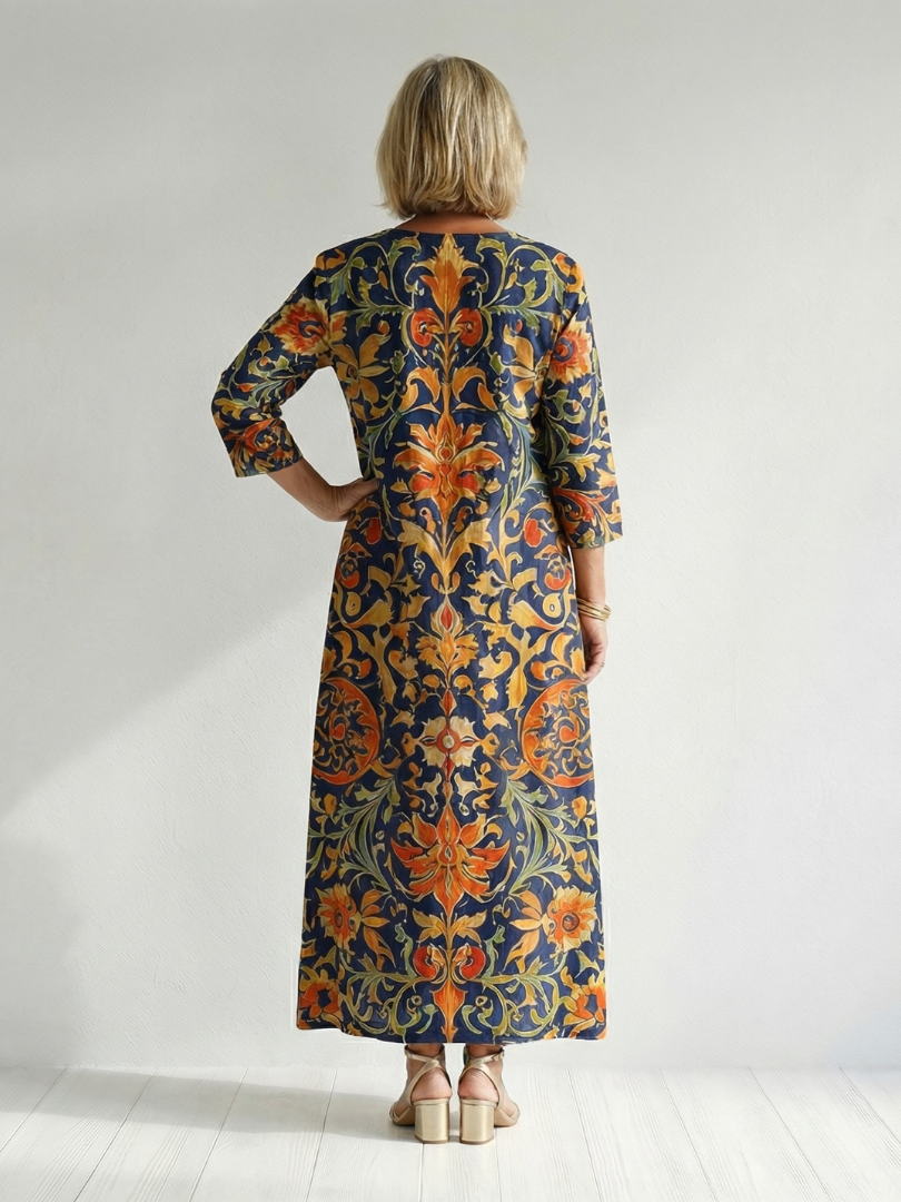 Elise floral midi dress, back view with navy and orange ornate print and 3/4 sleeves