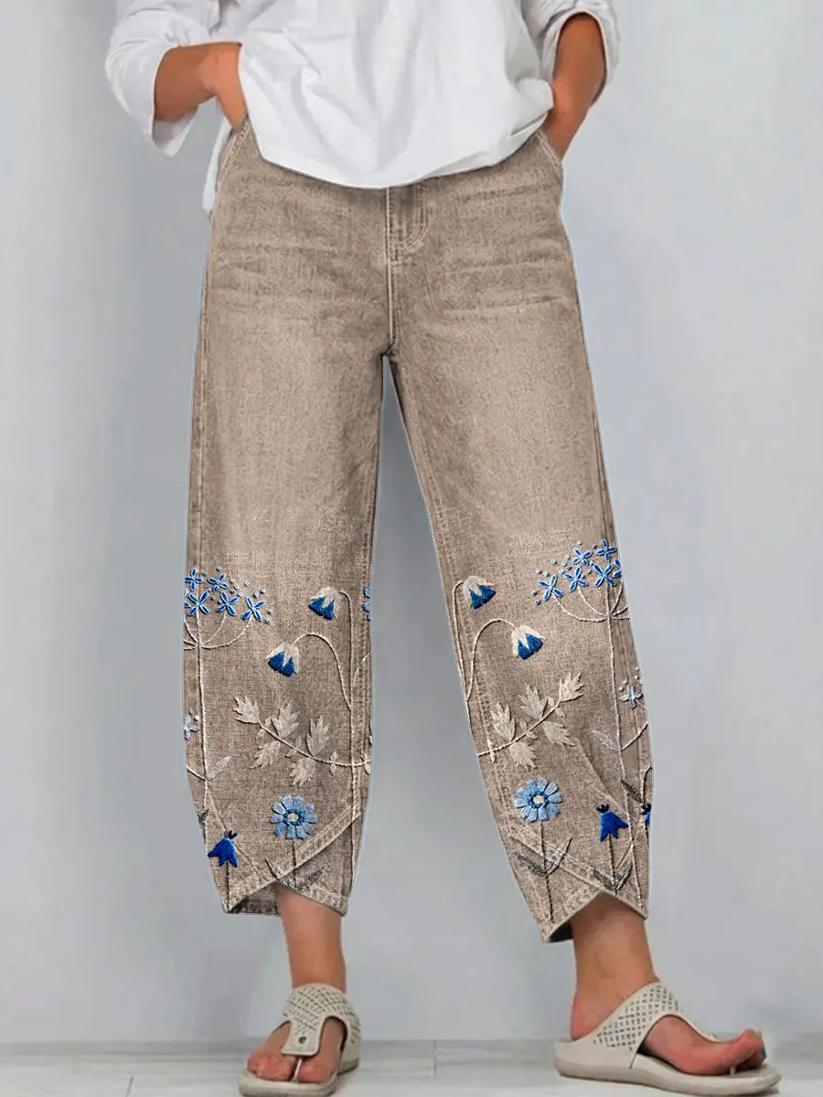 Khaki casual trousers with blue-and-white floral embroidery panels on the sides