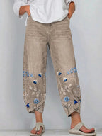 Khaki casual trousers with blue-and-white floral embroidery panels on the sides