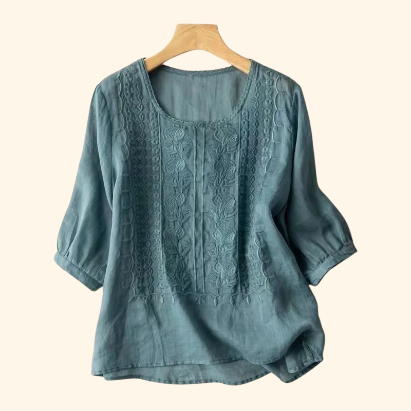 Teal embroidered blouse with round neck, three-quarter sleeves, textured yoke detail