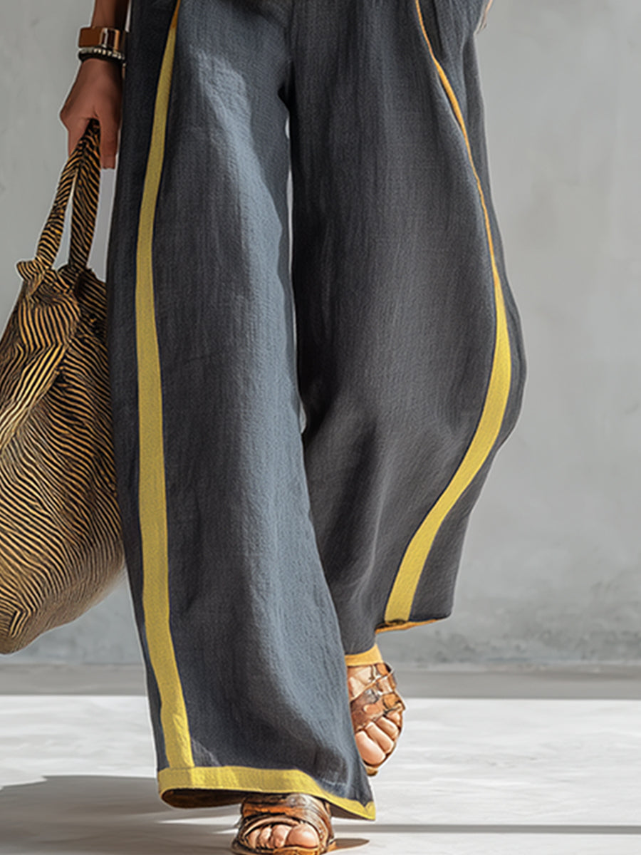 Two-piece set, white sleeveless top and wide-leg pants with gold piping