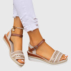 White and brown platform sandals with woven straps and adjustable ankle buckle
