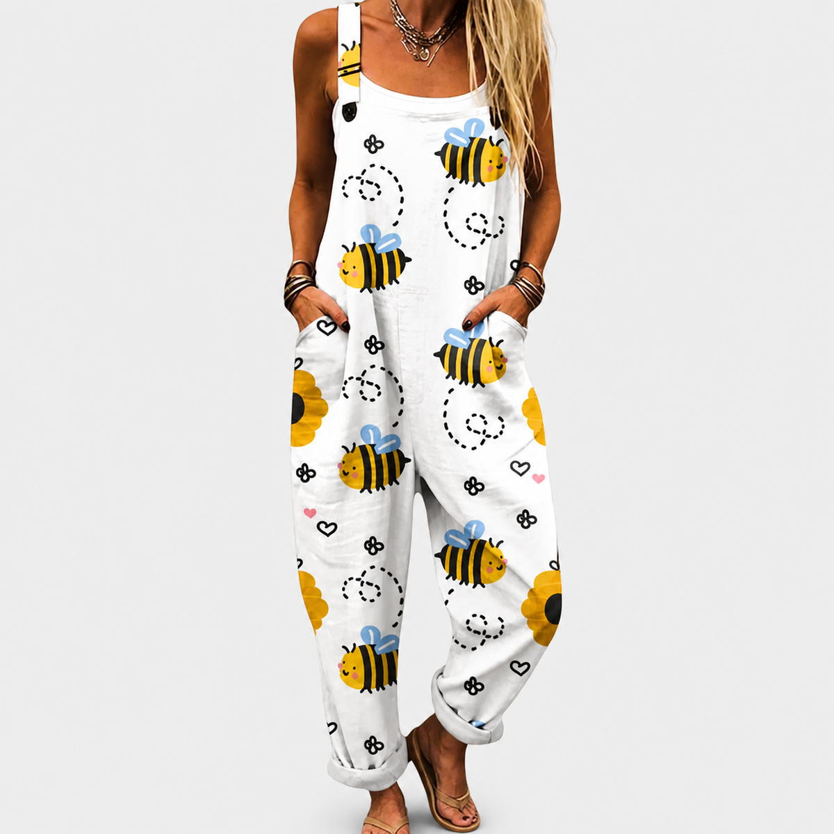 White sleeveless printed jumpsuit with bee and heart motifs, loose leg