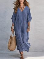 Blue pinstripe maxi dress with V-neck, loose drape, wide three-quarter sleeves