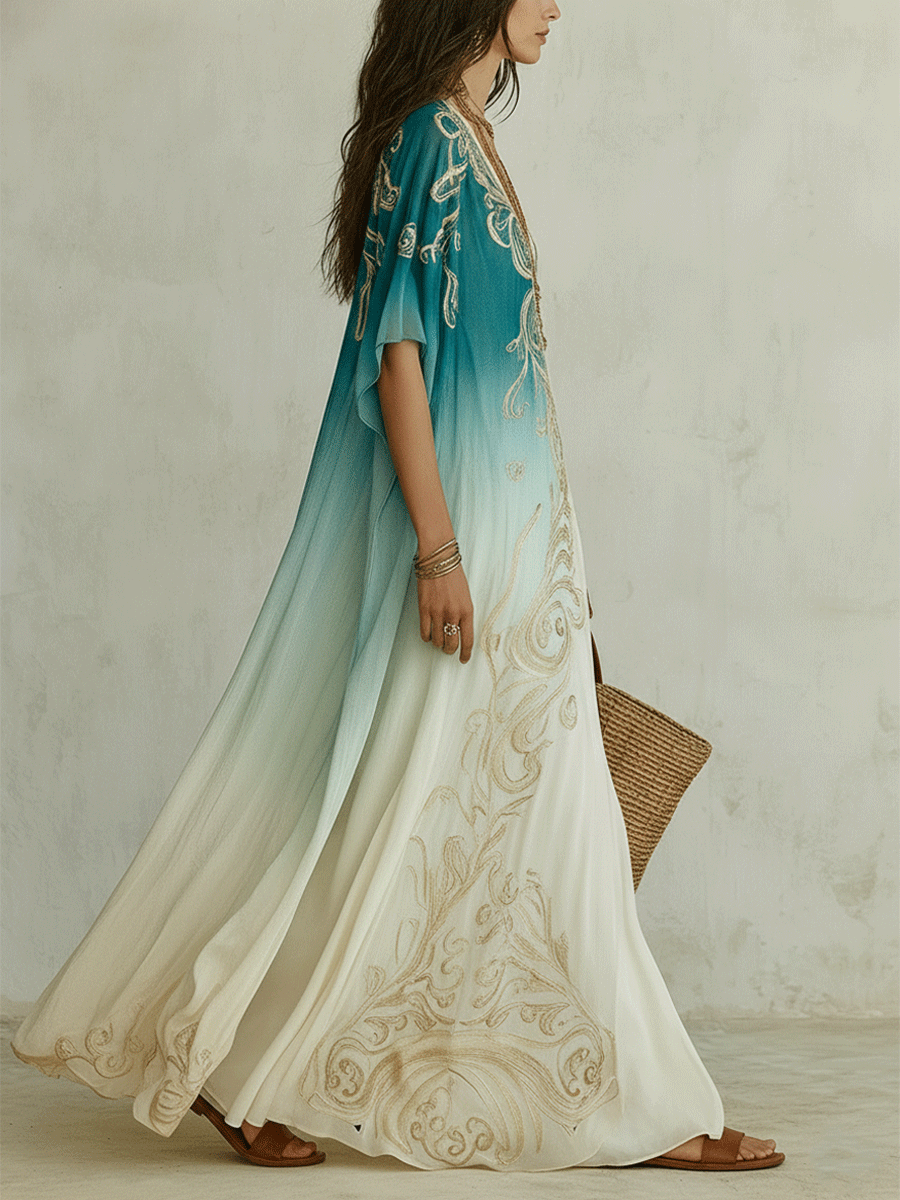 Side view of aqua ombre kaftan maxi dress with cape sleeves and gold embroidered accents