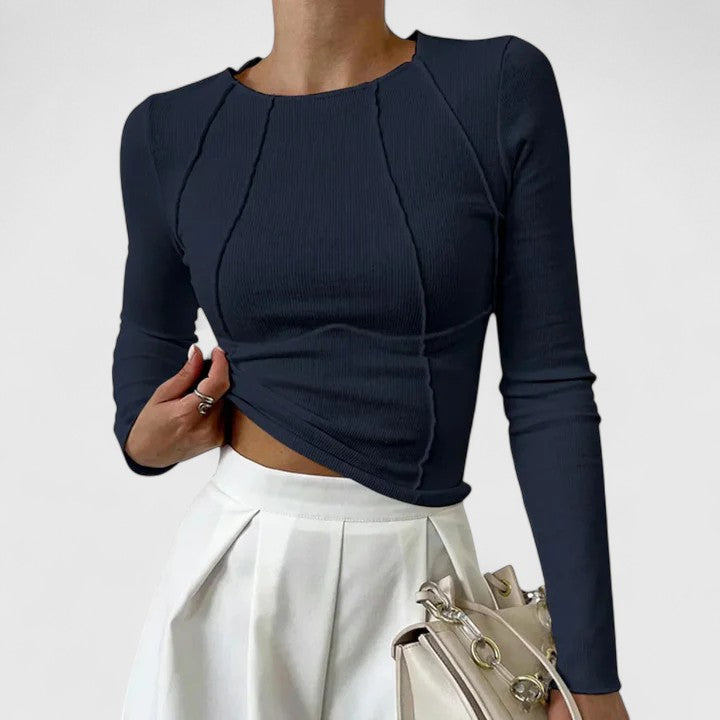 Navy ribbed knit long-sleeve top with round neck and draped asymmetrical hem
