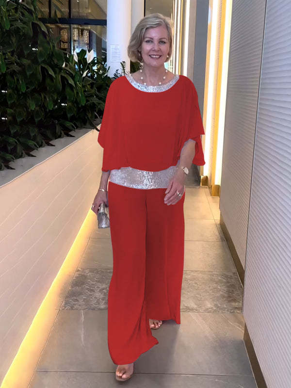 Red 2-piece set with draped top, wide-leg pants, and silver sequin waist belt