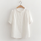 Lightweight cotton shirt in white, short sleeves, button front, ruffled crew neck.